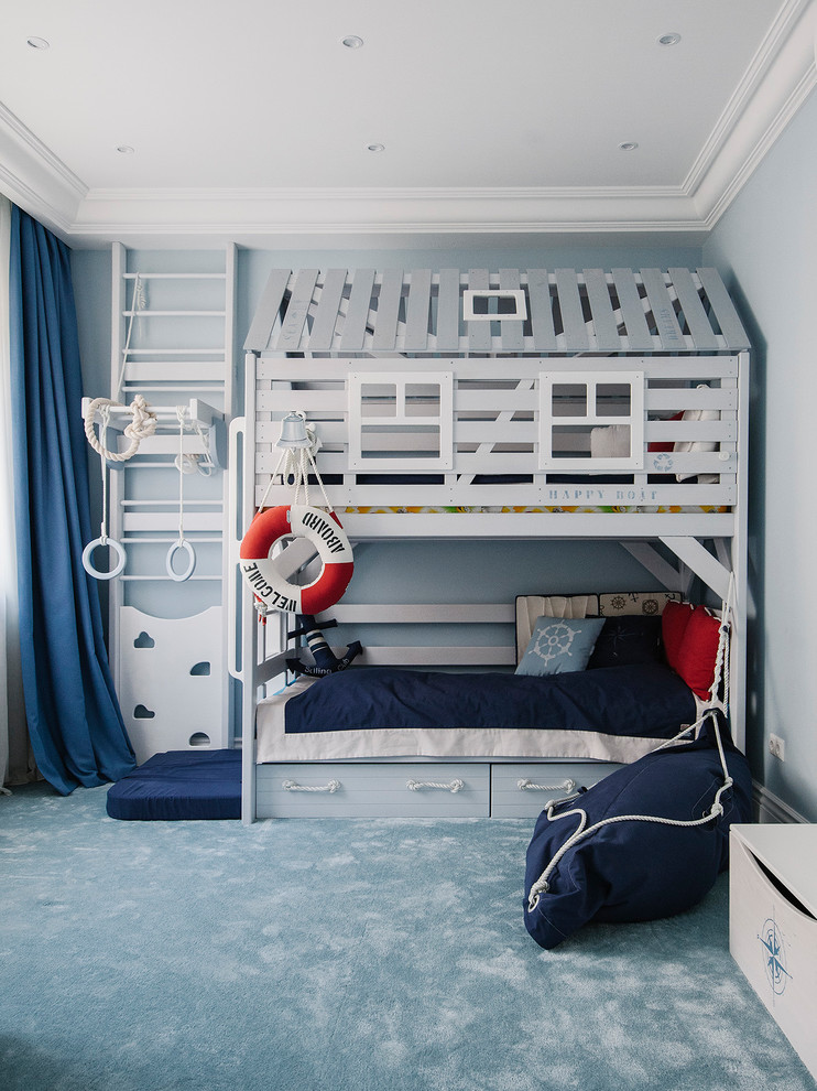 На фото: большая детская в морском стиле с спальным местом, синими стенами, ковровым покрытием и синим полом для мальчика