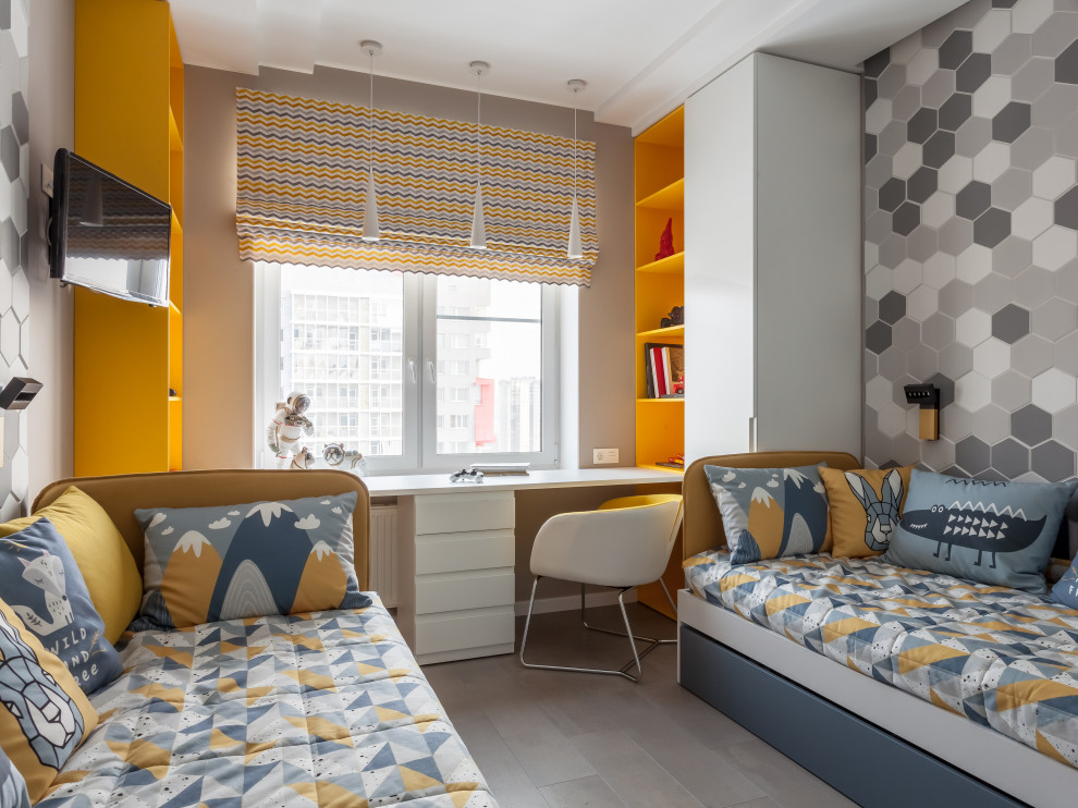 This is an example of a medium sized contemporary children’s room for boys in Other with grey walls and grey floors.