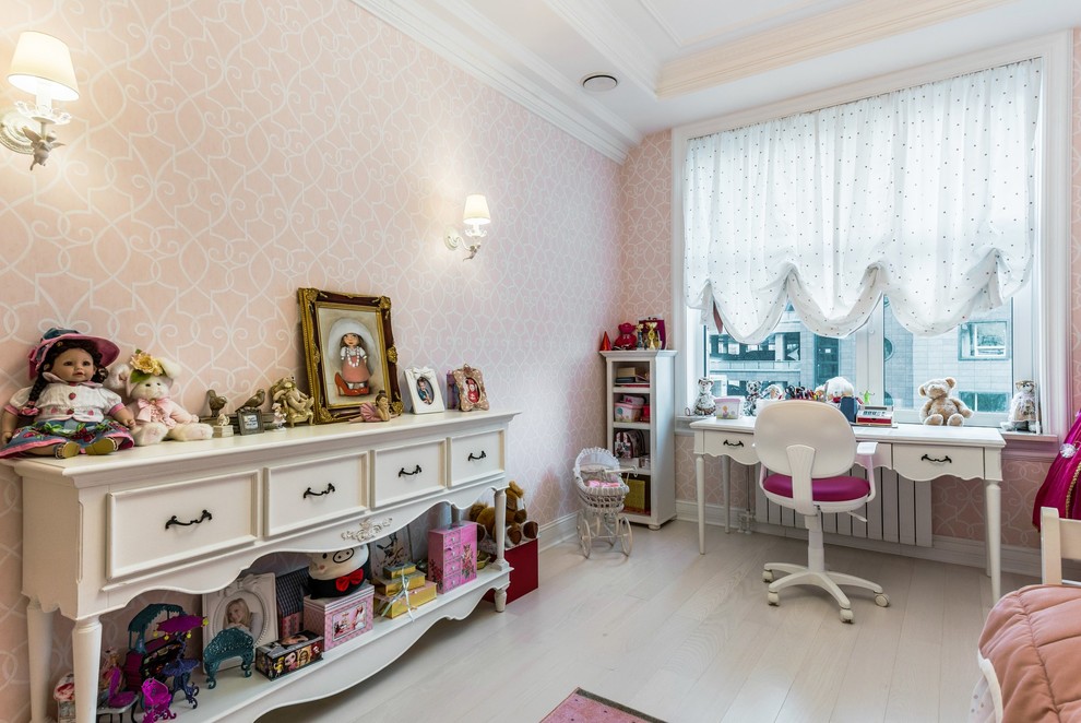 Photo of a medium sized classic children’s room for girls in Saint Petersburg with pink walls, medium hardwood flooring and white floors.