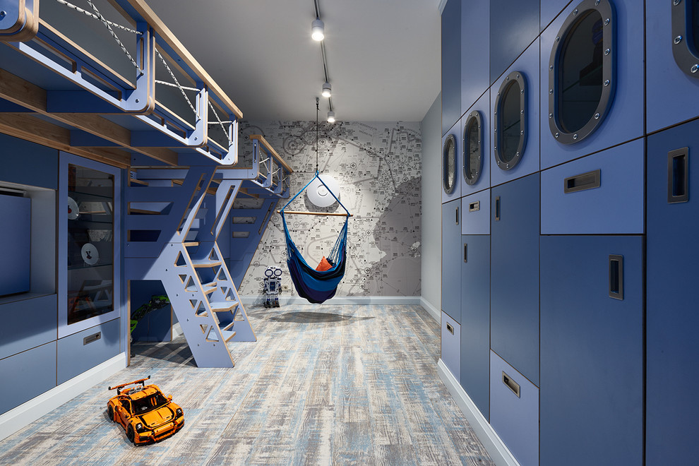 Idée de décoration pour une chambre d'enfant marine avec un mur gris.