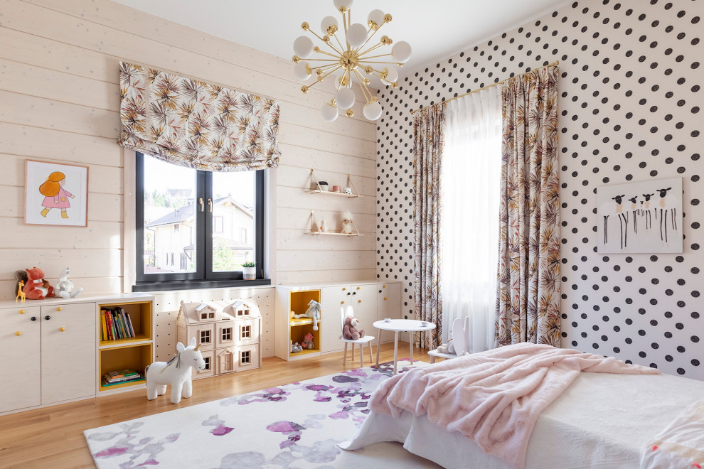 Inspiration for a contemporary girl playroom remodel in Moscow with white walls