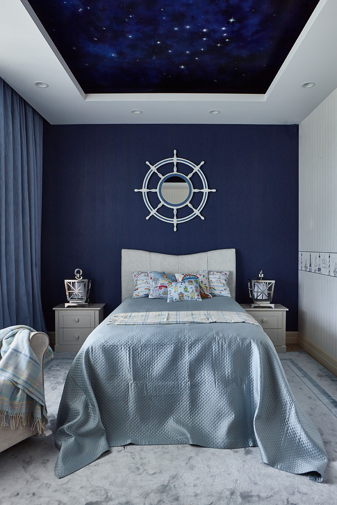 Immagine di una cameretta per bambini stile marino con pareti blu, moquette e pavimento grigio
