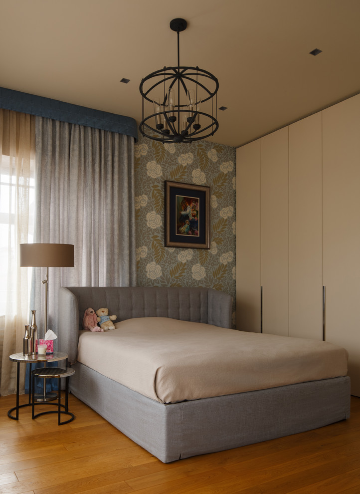 Inspiration for a contemporary kids' bedroom for girls in Moscow with medium hardwood flooring.
