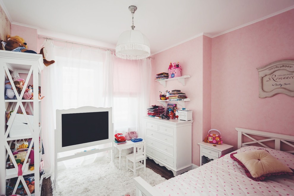 Inspiration for a contemporary children’s room for girls in Other with pink walls, carpet and white floors.