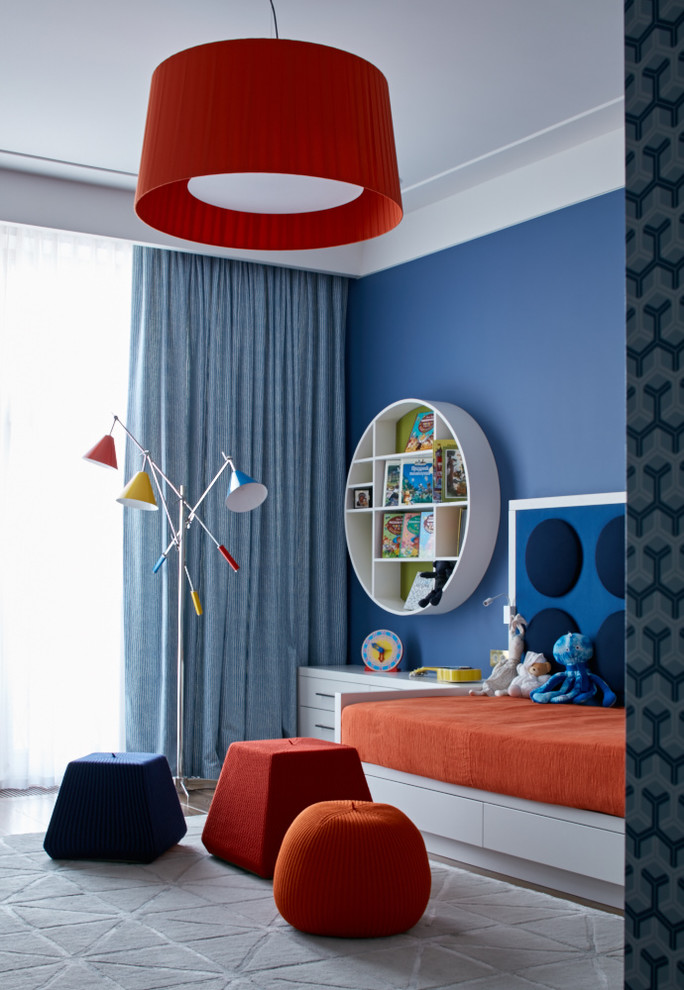 Contemporary children’s room for girls in Moscow with blue walls and carpet.