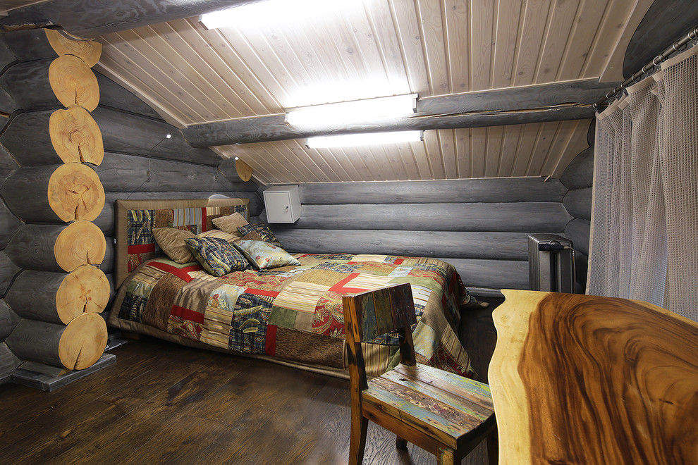 Inspiration för ett rustikt könsneutralt tonårsrum, med grå väggar och mörkt trägolv