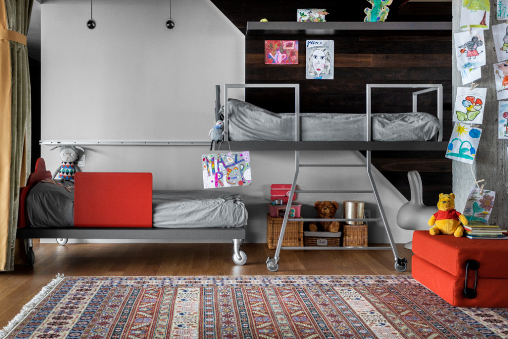 На фото: нейтральная детская среднего размера в современном стиле с спальным местом, белыми стенами, паркетным полом среднего тона и красным полом для ребенка от 4 до 10 лет с
