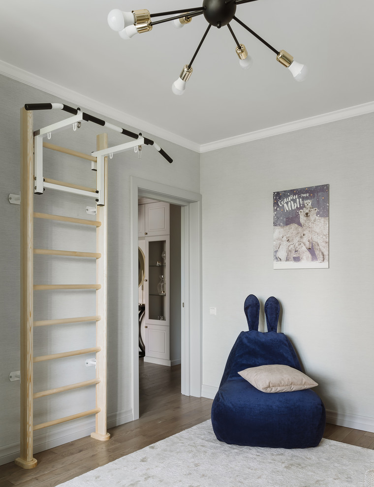 Medium sized classic kids' bedroom for boys in Moscow with grey walls, medium hardwood flooring and brown floors.