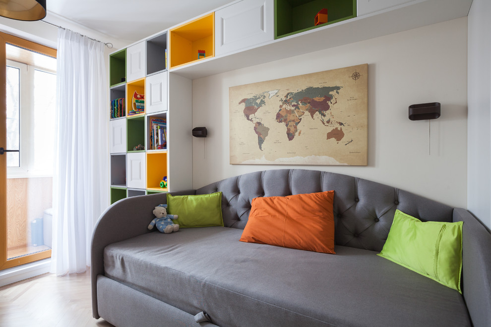 Small contemporary gender neutral kids' bedroom in Moscow with yellow walls, light hardwood flooring and beige floors.