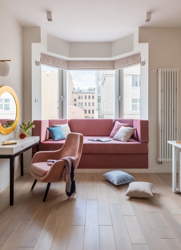 This is an example of a contemporary kids' bedroom for girls in Saint Petersburg with white walls, light hardwood flooring and beige floors.