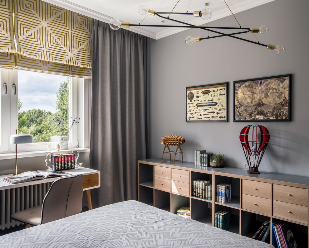 This is an example of a contemporary kids' study space for boys in Moscow with grey walls and feature lighting.