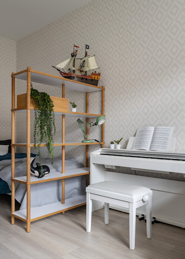 This is an example of a medium sized scandinavian children’s room for boys in Saint Petersburg with white walls and medium hardwood flooring.