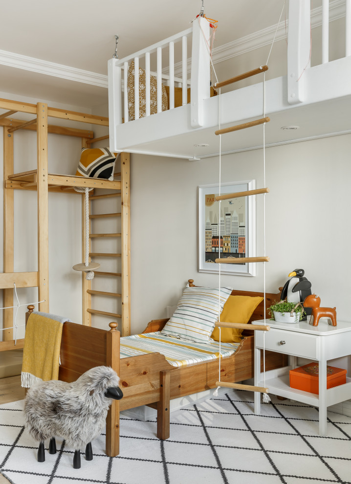 This is an example of a scandinavian kids' bedroom in Saint Petersburg with white walls, light hardwood flooring and beige floors.