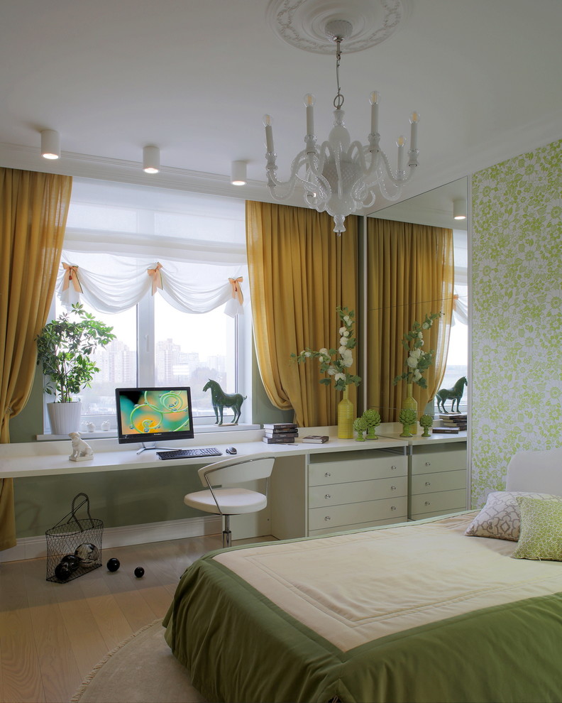Inspiration for a medium sized traditional teen’s room for girls in Other with green walls, beige floors and light hardwood flooring.