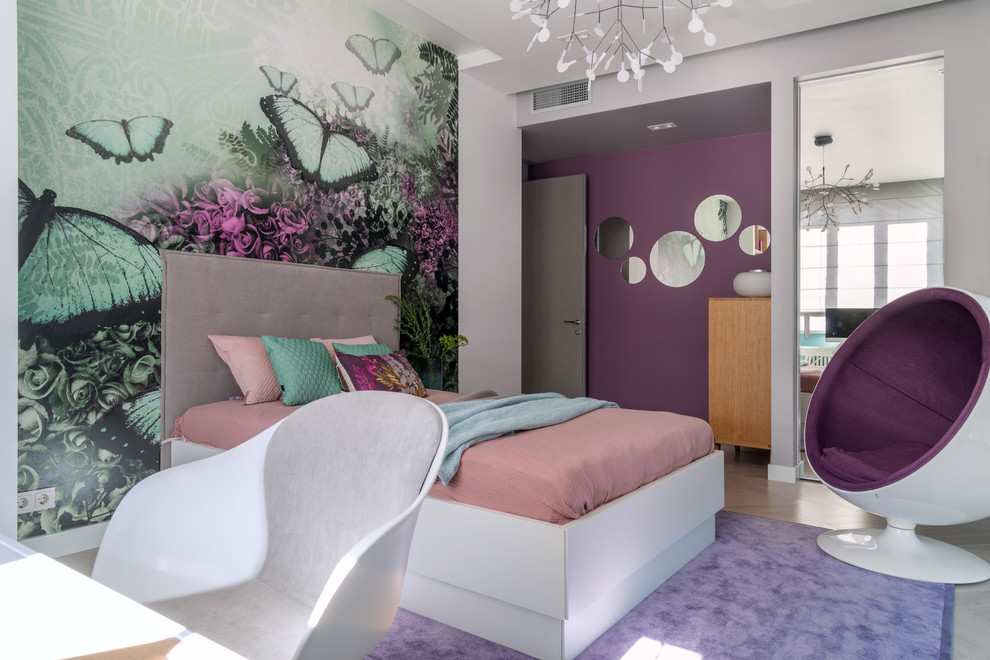 Inspiration for a contemporary kids' bedroom for girls in Moscow with multi-coloured walls, light hardwood flooring and beige floors.