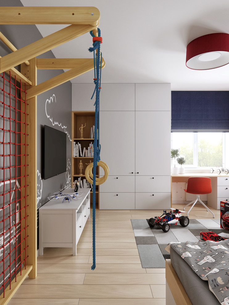 Immagine di una cameretta per bambini da 4 a 10 anni minimal di medie dimensioni con parquet chiaro, pavimento beige e pareti multicolore
