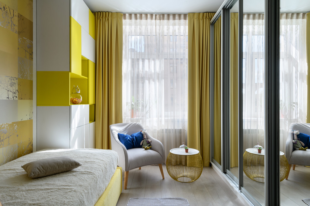 Photo of a medium sized contemporary children’s room for girls in Moscow with laminate floors and grey floors.