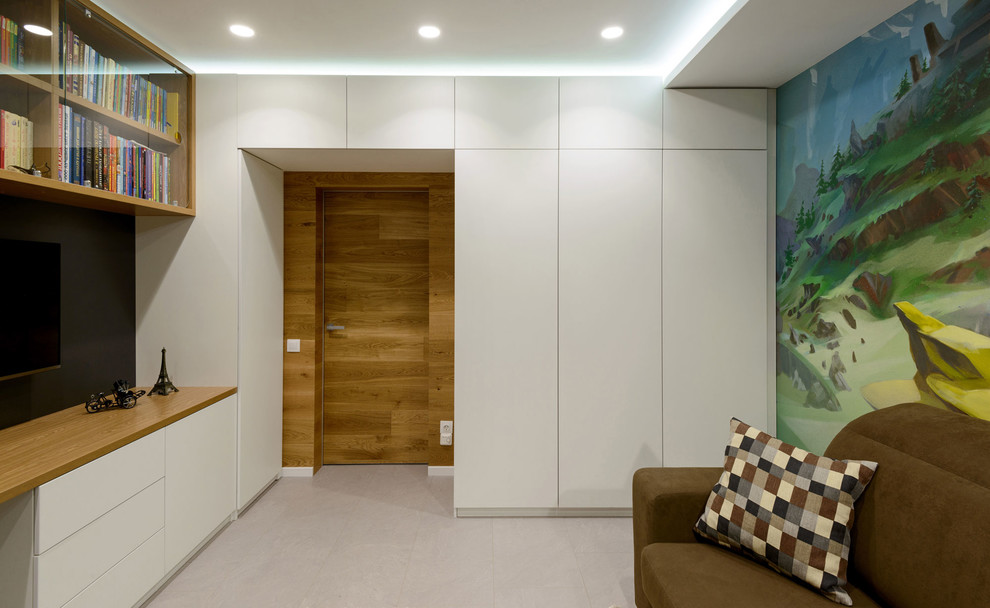 Esempio di una cameretta neutra minimal con pareti multicolore e pavimento grigio
