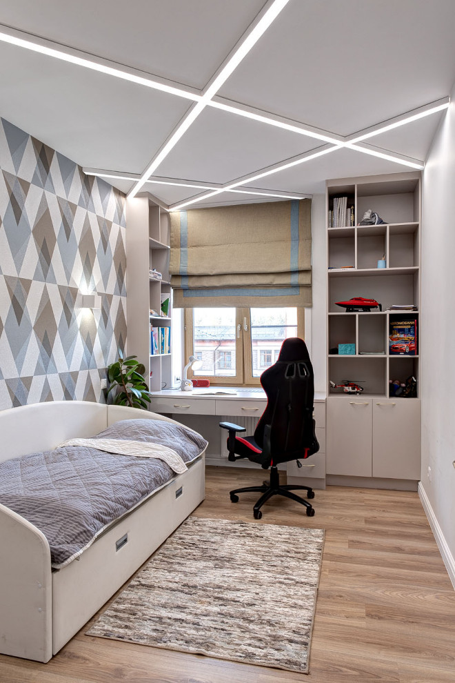 Inspiration for a small contemporary children’s room for boys in Moscow with multi-coloured walls, laminate floors, yellow floors and wallpapered walls.