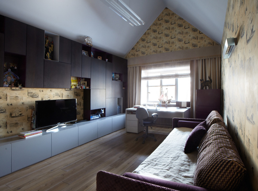 This is an example of a medium sized scandi teen’s room for boys in Moscow with medium hardwood flooring.