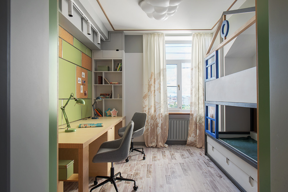 Foto de habitación infantil unisex actual con escritorio, paredes verdes y suelo beige