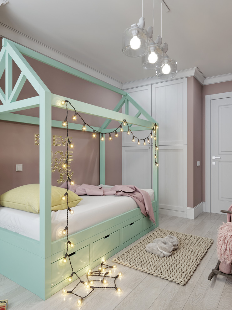 Inspiration for a small scandinavian girl light wood floor and beige floor kids' room remodel in Valencia with pink walls