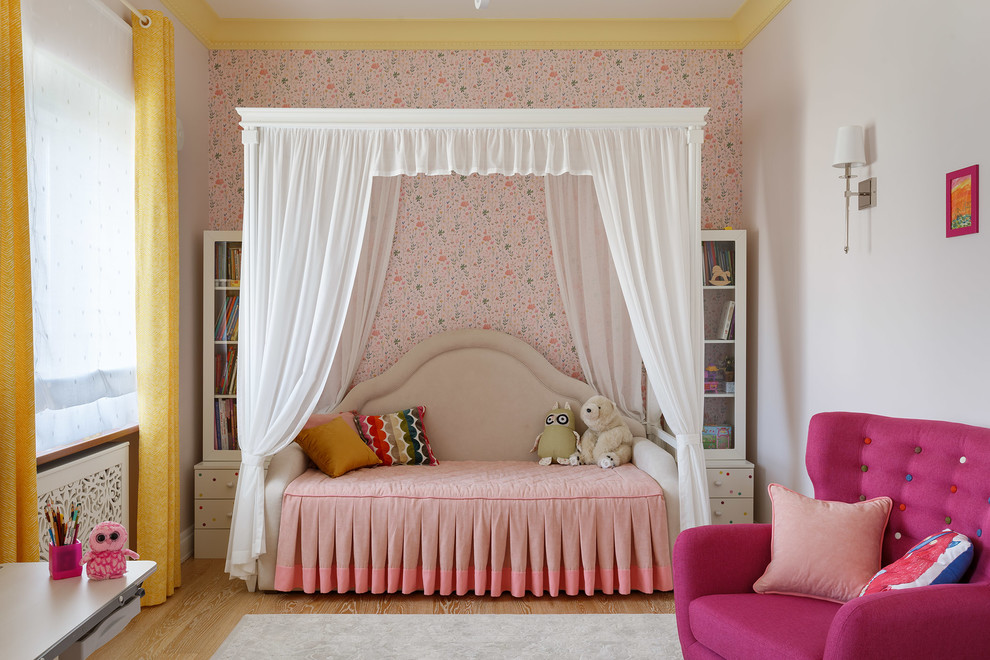 Inspiration for a medium sized classic children’s room for girls in Saint Petersburg with pink walls, medium hardwood flooring and brown floors.
