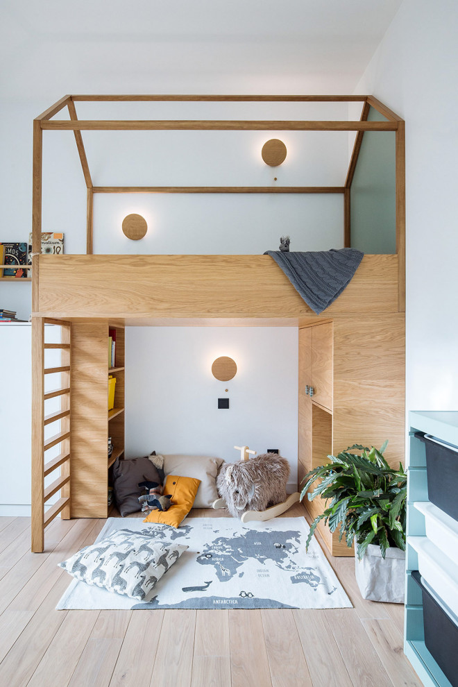 Inspiration for a contemporary kids' bedroom in Moscow with white walls, light hardwood flooring and beige floors.