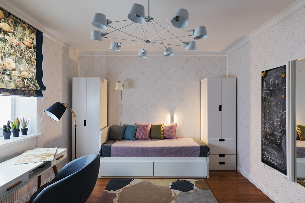 Photo of a medium sized contemporary teen’s room for girls in Other with white walls and dark hardwood flooring.