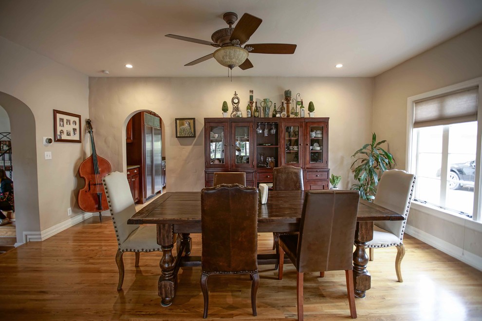 Large traditional enclosed dining room in Phoenix with beige walls and light hardwood flooring.