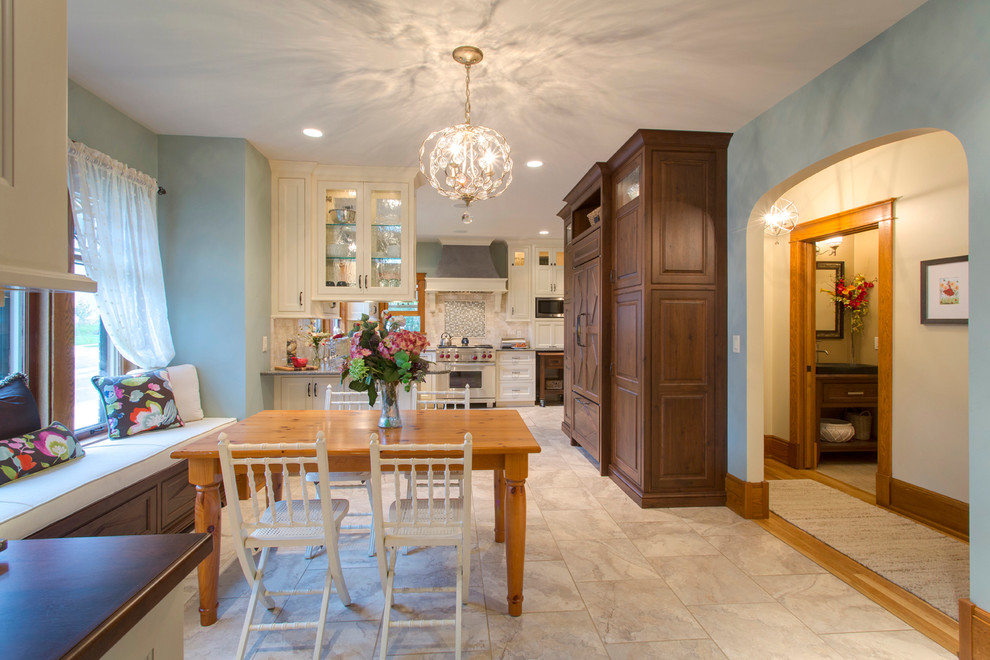 Photo of a traditional kitchen/dining room in Other with blue walls and porcelain flooring.