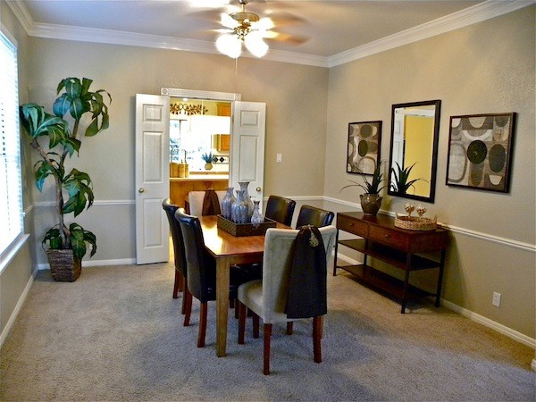 Small classic enclosed dining room in Austin with grey walls and carpet.