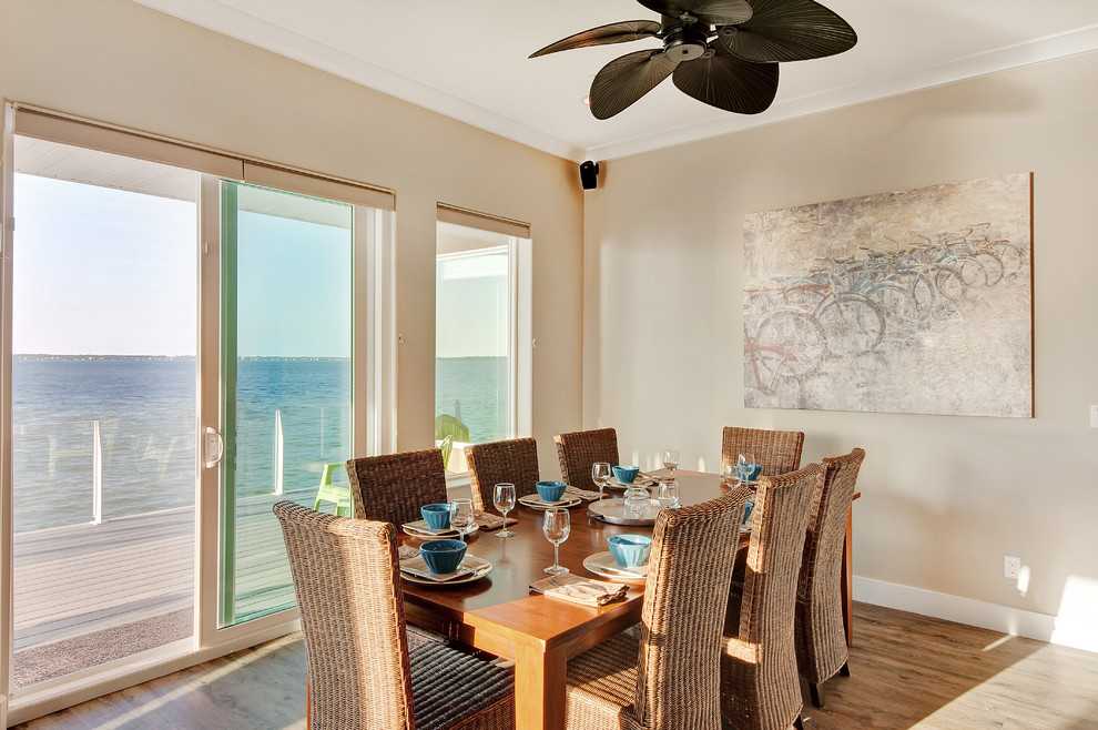 Nautical dining room in Miami with beige walls.