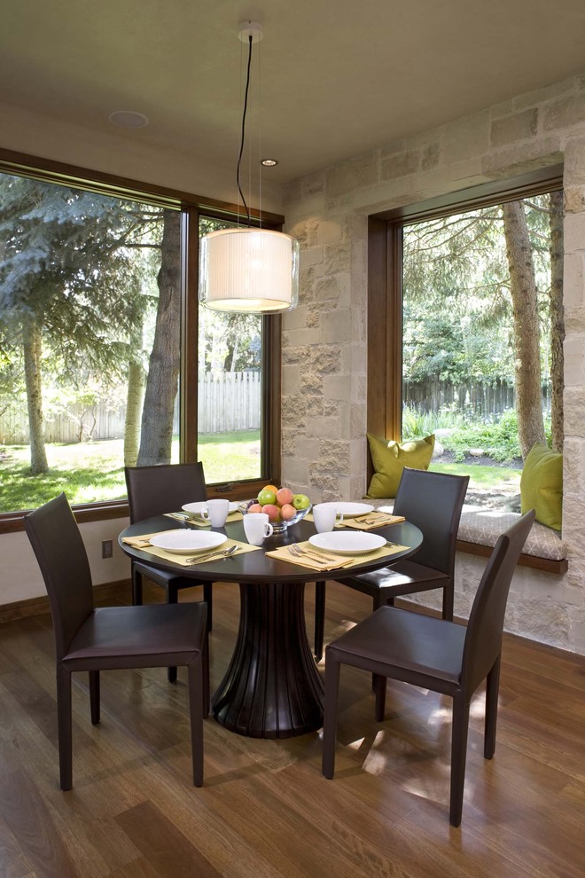 Inspiration for a contemporary dining room in Denver with dark hardwood flooring.