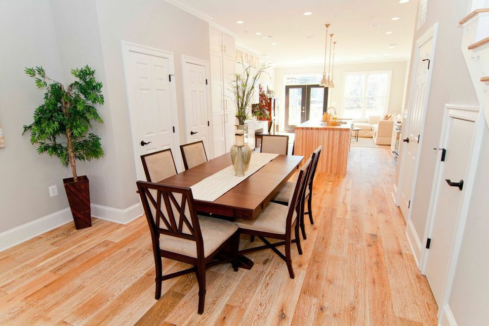 Inspiration for a classic dining room in DC Metro with grey walls and light hardwood flooring.