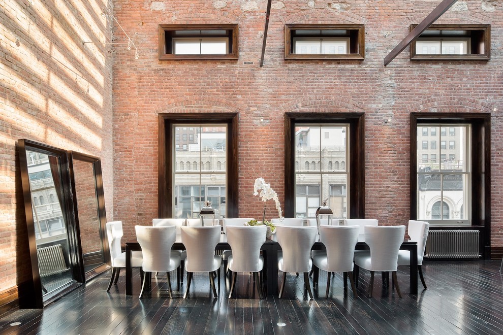 Contemporary dining room in New York with dark hardwood flooring.