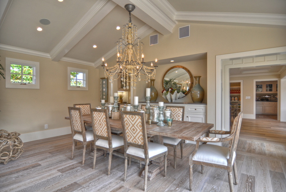 Inspiration for a coastal medium tone wood floor dining room remodel in Los Angeles with beige walls