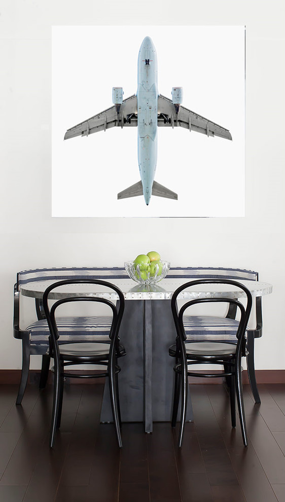 This is an example of a contemporary dining room in New York with white walls and dark hardwood flooring.