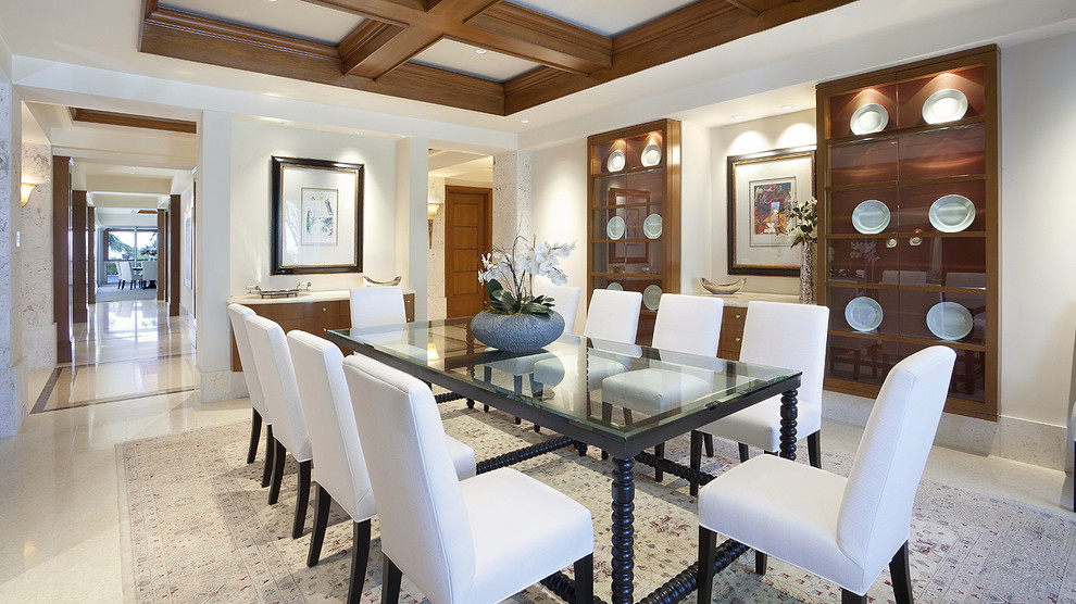 Example of an island style dining room design in Miami