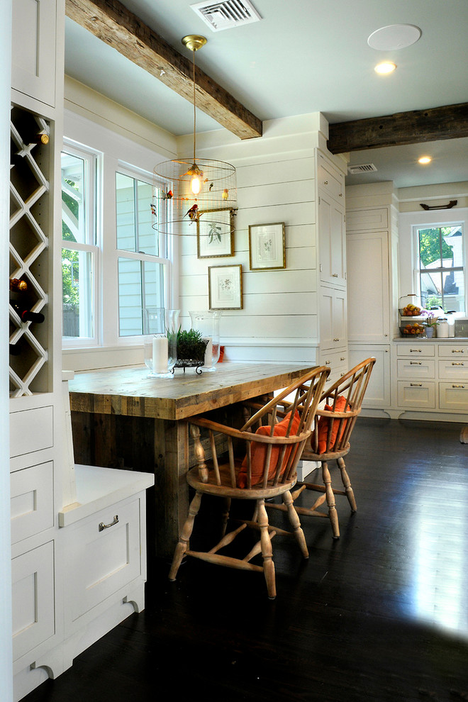 Dining room - cottage dark wood floor dining room idea in New York with white walls