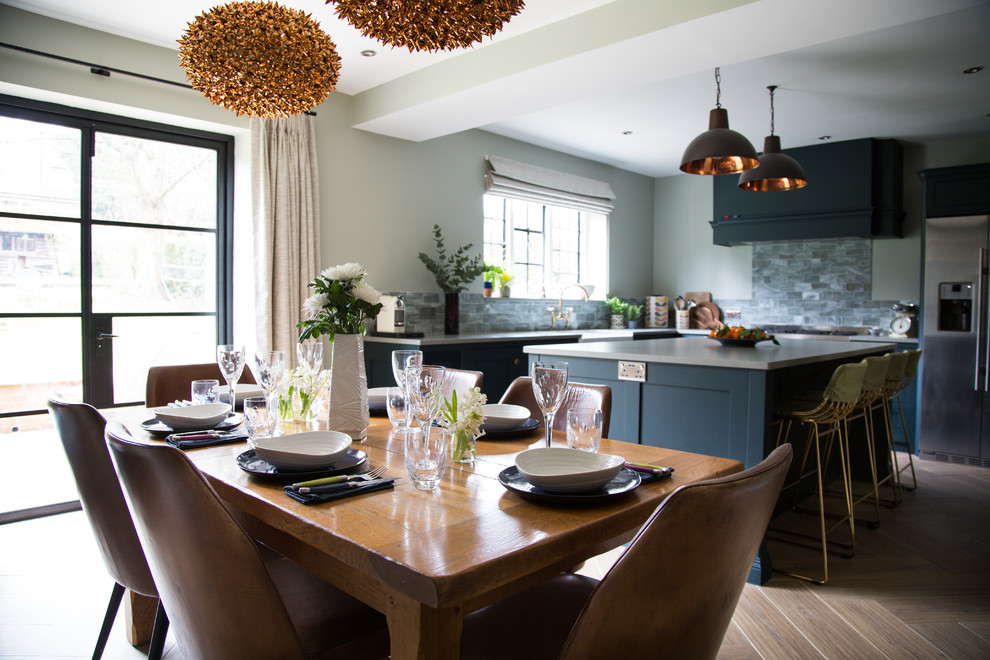Inspiration for a classic dining room in Kent with grey walls, dark hardwood flooring and brown floors.
