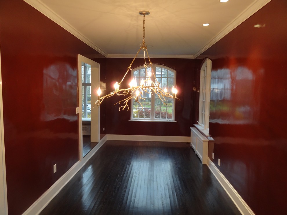 Medium sized classic enclosed dining room in New York with red walls, dark hardwood flooring and no fireplace.