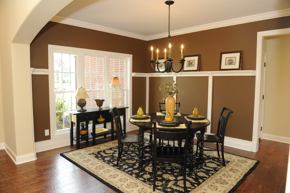 Elegant dark wood floor dining room photo in Other with brown walls