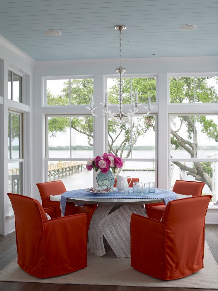 Kitchen/dining room combo - coastal medium tone wood floor kitchen/dining room combo idea in Charleston with white walls