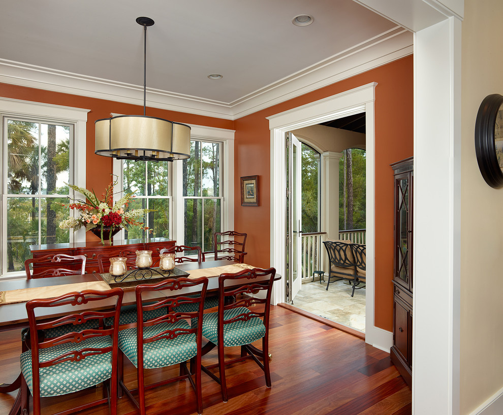 Inspiration for a traditional dining room in Charleston with brown walls.