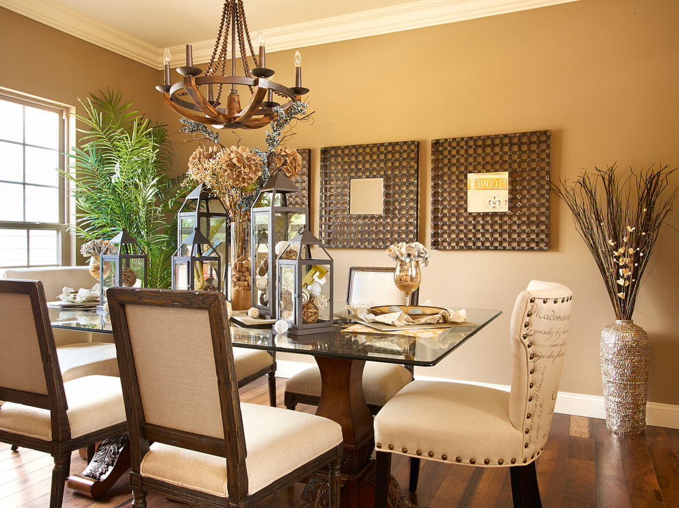 Inspiration for a traditional dining room in St Louis with beige walls and dark hardwood flooring.