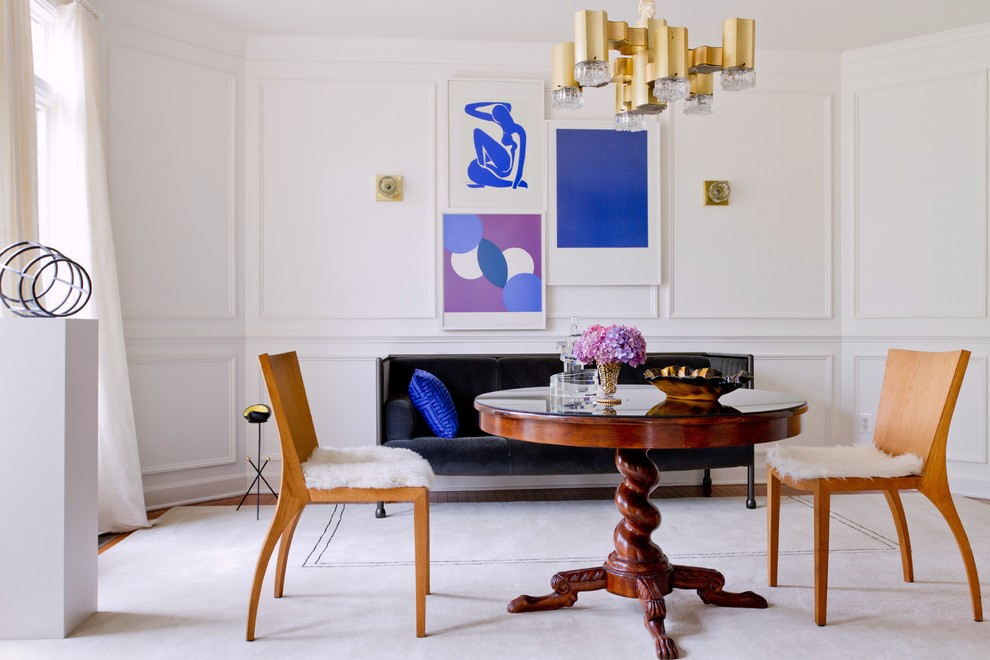 This is an example of a contemporary dining room in DC Metro with white walls.
