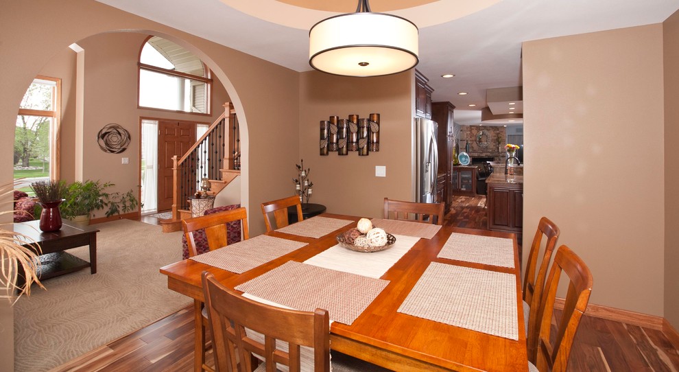 Enclosed dining room - mid-sized traditional medium tone wood floor enclosed dining room idea in Other with beige walls