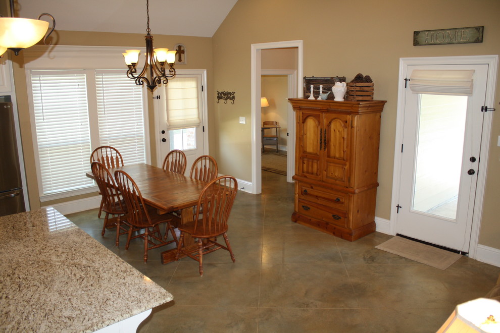 Example of a mid-sized classic concrete floor great room design in New Orleans with beige walls