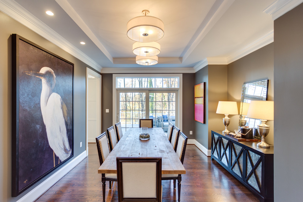Photo of a medium sized traditional enclosed dining room in DC Metro with grey walls and medium hardwood flooring.
